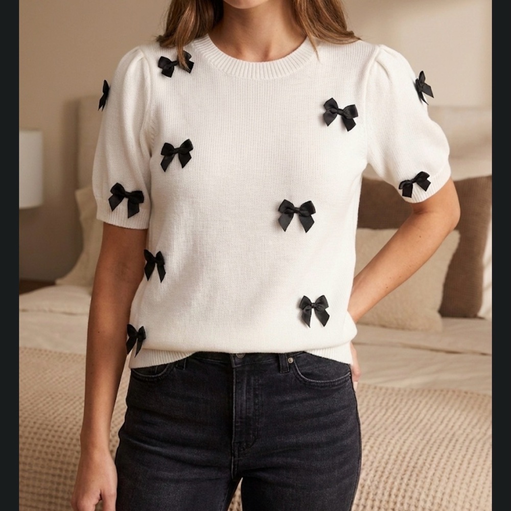 Chic White Sweater with Black Bows